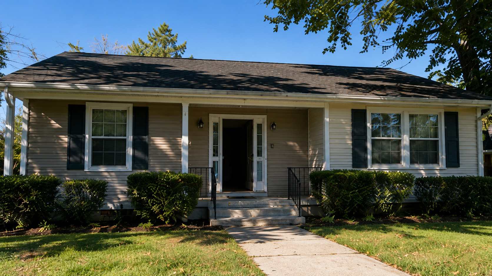 Property owner inspecting an empty residential home while considering options for selling a vacant property.